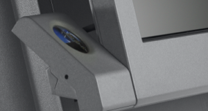 Toshiba SurePOS 580 fingerprint reader mounted on the lower left corner of the monitor.