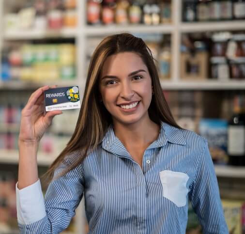 Happy Grocery Customer Holding Loyalty Points Card