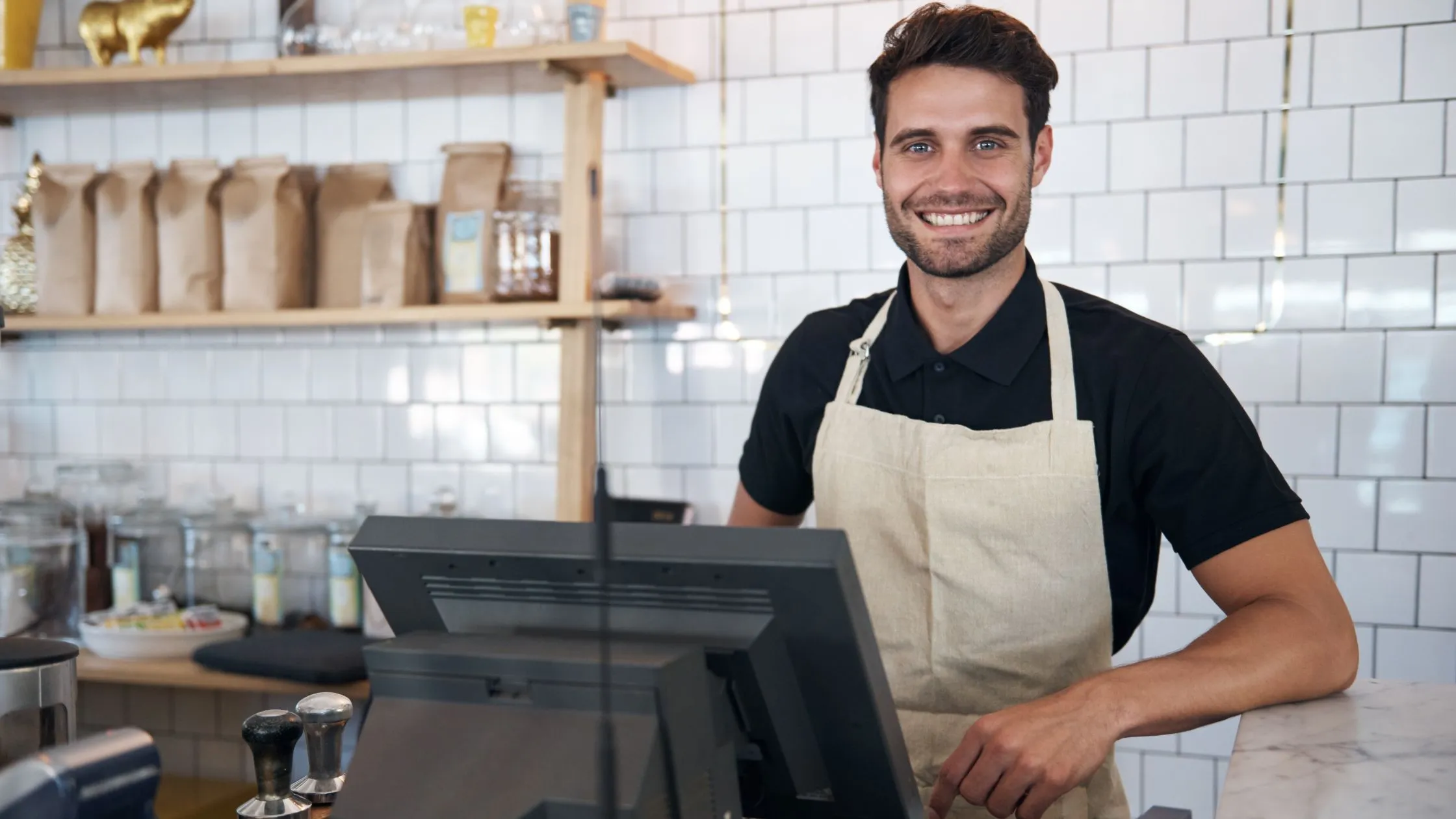 a man using table service pos system