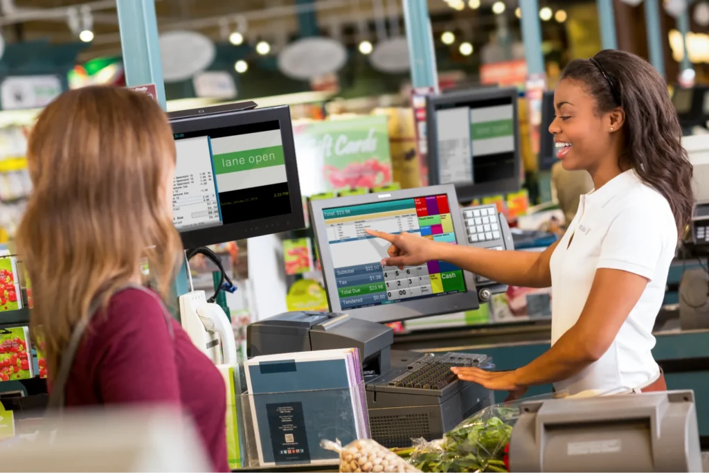 a cashier using Specialty Foods POS System