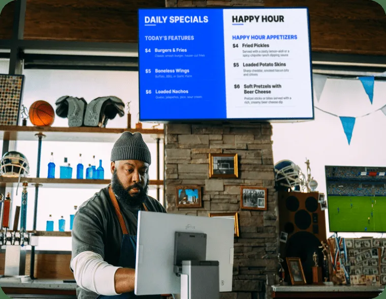 Genius digital menu board showing daily specials and happy hour in a bar