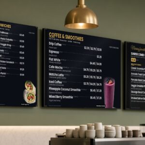 Digital menu boards above a quick service restaurant counter showing coffee and smoothie prices with calories